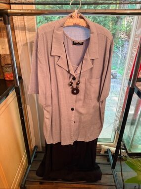 Light Lavender Short-Sleeve Button Shirt with Necklace over full length dress.